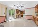 Kitchen area with wood cabinets and a sliding door leading to the backyard, offering easy access to outdoor space at 324 County Line Rd, Fayetteville, GA 30215