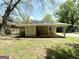 Back exterior of property showing flat roof, yard and back entrance at 2155 Meador Se Ave, Atlanta, GA 30315