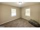 Cozy bedroom featuring carpet, two windows, and natural light at 2155 Meador Se Ave, Atlanta, GA 30315