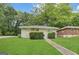 Charming single-story home featuring a manicured lawn and inviting front entrance at 2155 Meador Se Ave, Atlanta, GA 30315