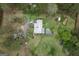 A top-down view of a home with an above-ground pool and surrounded by trees and open space at 24 Shiloh Church Rd, Carrollton, GA 30116