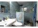 Luxurious bathroom features blue marble tiling, a walk-in shower, and modern fixtures at 24 Shiloh Church Rd, Carrollton, GA 30116