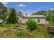 Cozy home featuring vinyl siding, a metal roof, and ample yard space, perfect for outdoor activities at 24 Shiloh Church Rd, Carrollton, GA 30116