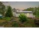 Cozy home featuring vinyl siding, a metal roof, and ample yard space, perfect for outdoor activities at 24 Shiloh Church Rd, Carrollton, GA 30116