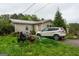 Exterior shot shows a home with a well-maintained yard, showcasing the home's curb appeal and neighborhood charm at 24 Shiloh Church Rd, Carrollton, GA 30116