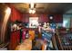 A disorganized kitchen with red cabinets, a tin ceiling, and a stainless steel refrigerator at 24 Shiloh Church Rd, Carrollton, GA 30116