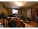 A cluttered living room featuring a wood-burning stove and a doorway adorned with festive decorations at 24 Shiloh Church Rd, Carrollton, GA 30116