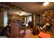 A cluttered living room with decorative artwork and a cozy seating area featuring an abundance of storage at 24 Shiloh Church Rd, Carrollton, GA 30116
