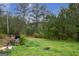 The landscaped yard includes mature trees and a small shed at 24 Shiloh Church Rd, Carrollton, GA 30116