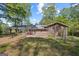 Brick home, fenced-in backyard, and carport in suburban neighborhood at 9155 Lakeview Sw Dr, Covington, GA 30014