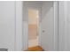 Hallway view into a bathroom with a shower and vanity at 9155 Lakeview Sw Dr, Covington, GA 30014
