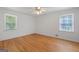 Bright bedroom with hardwood floors and two windows at 9155 Lakeview Sw Dr, Covington, GA 30014
