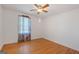 Bedroom with hardwood floors and a window at 9155 Lakeview Sw Dr, Covington, GA 30014