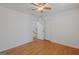 Bright bedroom features hardwood floors, a ceiling fan, and neutral paint, creating a calming atmosphere at 9155 Lakeview Sw Dr, Covington, GA 30014