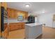 Kitchen featuring wooden cabinets, white countertops, and black appliances at 9155 Lakeview Sw Dr, Covington, GA 30014