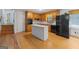 Kitchen featuring wooden cabinets, white countertops, and modern black appliances at 9155 Lakeview Sw Dr, Covington, GA 30014