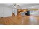 Open-concept living and kitchen area with hardwood floors and natural light at 9155 Lakeview Sw Dr, Covington, GA 30014