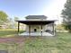 Backyard view of a covered patio and spacious yard, with an air conditioning unit at 825 Rapid Ct, Mcdonough, GA 30252