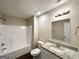 Bathroom with tub and shower, granite vanity, matching mirror and coordinated fixtures at 825 Rapid Ct, Mcdonough, GA 30252