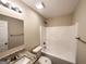 Bathroom featuring granite countertop, shower and tub combination with white fixtures at 825 Rapid Ct, Mcdonough, GA 30252