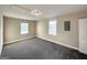 Spacious bedroom with neutral walls, carpet flooring, and good natural light at 825 Rapid Ct, Mcdonough, GA 30252