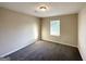 Cozy bedroom with neutral walls, carpet flooring, and a bright window at 825 Rapid Ct, Mcdonough, GA 30252