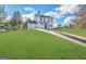 Charming two-story home with a well-manicured lawn and a long driveway at 825 Rapid Ct, Mcdonough, GA 30252