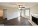 Inviting living room with a fireplace, wood-look floors, and natural light at 825 Rapid Ct, Mcdonough, GA 30252
