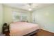 Bedroom featuring natural light from a window, a ceiling fan, and hardwood floors at 215 North Mourning Dove N Dr, Fayetteville, GA 30215