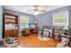 Bedroom featuring hardwood floors, natural light from the window, and a ceiling fan at 215 North Mourning Dove N Dr, Fayetteville, GA 30215