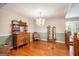 Elegant dining room featuring hardwood floors, a chandelier, and antique furniture at 215 North Mourning Dove N Dr, Fayetteville, GA 30215