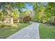 Long driveway leading to home surrounded by lush greenery and mature trees at 215 North Mourning Dove N Dr, Fayetteville, GA 30215