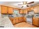 Traditional kitchen with wooden cabinets, granite countertops, and stainless steel appliances at 215 North Mourning Dove N Dr, Fayetteville, GA 30215