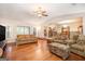 Inviting living room featuring hardwood floors and a view of the kitchen and dining area at 215 North Mourning Dove N Dr, Fayetteville, GA 30215