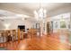 Open-concept living room with hardwood floors, chandelier, and great natural light at 215 North Mourning Dove N Dr, Fayetteville, GA 30215