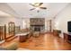 Cozy living room with stone fireplace, hardwood floors, and plenty of natural light at 215 North Mourning Dove N Dr, Fayetteville, GA 30215