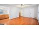 Spacious main bedroom featuring hard wood floors, ceiling fan, ensuite bathroom, and ample closet space at 215 North Mourning Dove N Dr, Fayetteville, GA 30215