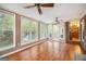 Bright sunroom with hardwood floors, large windows overlooking the pool and backyard at 215 North Mourning Dove N Dr, Fayetteville, GA 30215