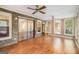 Sunroom with wood floors, brick accent wall and plenty of natural light at 215 North Mourning Dove N Dr, Fayetteville, GA 30215