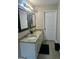 Bathroom with granite countertops and dual sinks at 220 Camerons Way, Covington, GA 30016