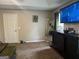 Spacious bedroom featuring TV, full-length mirror and dark wood dresser at 220 Camerons Way, Covington, GA 30016