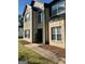 Inviting two-story brick home featuring large windows and a decorative welcome sign at 220 Camerons Way, Covington, GA 30016
