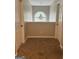 Hallway with a wall-sized window and neutral colors at 220 Camerons Way, Covington, GA 30016
