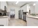 Well-equipped kitchen with stainless steel appliances and ample cabinet space at 220 Camerons Way, Covington, GA 30016