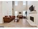 Spacious living room with high ceilings, a fireplace, and lots of natural light at 220 Camerons Way, Covington, GA 30016