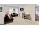 Upstairs living area with a small desk and comfortable seating, perfect for relaxation at 220 Camerons Way, Covington, GA 30016