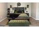 Cozy bedroom with stylish furnishings, decorative plants, and comfortable bedding at 220 Camerons Way, Covington, GA 30016