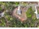 Aerial view of the house showcasing its location in a serene setting surrounded by lush trees and greenery at 1011 Austin Rd, Ellenwood, GA 30294