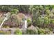 Aerial view of the house showcasing its location in a serene setting surrounded by lush trees and greenery at 1011 Austin Rd, Ellenwood, GA 30294