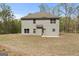Exterior view of home, featuring a concrete patio area, and yard at 1011 Austin Rd, Ellenwood, GA 30294